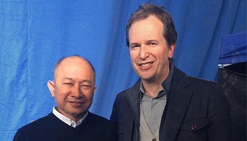Anthony Vogels with Director John Woo on set of “The Crossing” Article